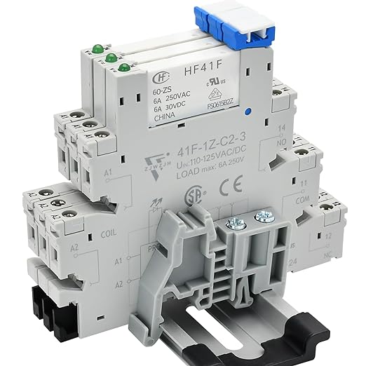 Three thin DIN relays mounted to a DIN rail.